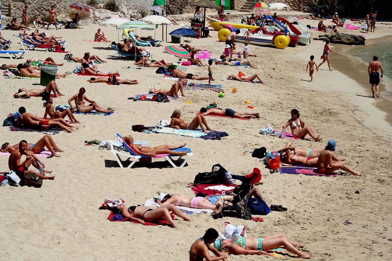 Naked At A Beach sucking cocks